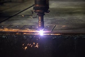 plasma torch cutting through steel