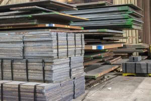 many stacks of large steel plates